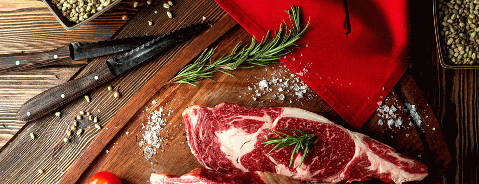 Top View of Meat Counter With Trays of Chicken Legs