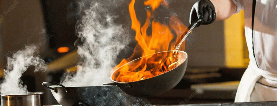 Cook Making Dinner in the Kitchen of High-end Restaurant
