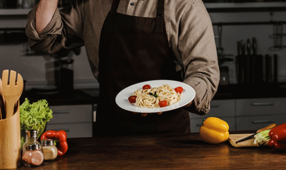 Chef Holding Plate With Pasta and Making Ok Sign
